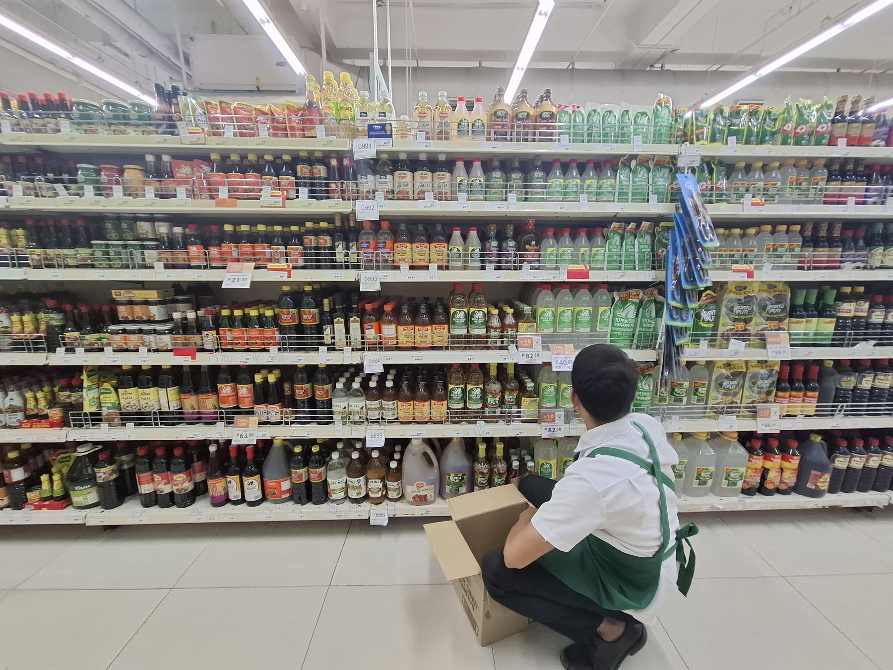 Accord ACES merchandiser restocking a supermarket shelf